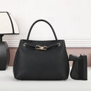 Color balck purse designed to carry both lethal and non lethal weapons.