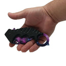Karambit knife purple galaxy in hand closed