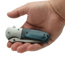 Knife woodgrain blue handle closed in hand