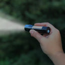 Micro flashlight shown in use.