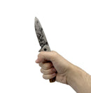 Spring assisted knife drop point blade in hand