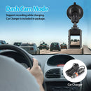 Car dashboard with a dash cam and car charger, showing a road scene.