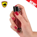 Bulk Wholesale bling it on pepper Spray in color red held in hand