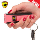 Bulk Wholesale guard dog hornet 2 stun gun in color pink and black in hand