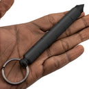 Kubaton Keychain with disguised hidden knife shown in hand closed position