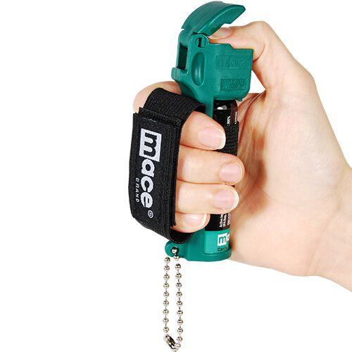 Mace muzzle image shows how to depress lever to spray for protection.