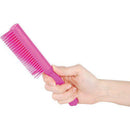 Pink Plastic comb with hidden knife in hand