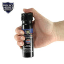 Police Strength 3 ounce Flip top pepper spray in hand