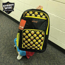 Streetwise emoji yellow bulletproof backpack displayed being used