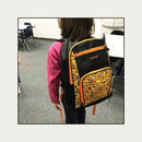 Streetwise Orange Emoji Bulletproof Backpack Worn by student