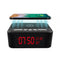 Digital clock with wireless charging pad and built-in spy surveillance camera.