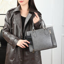 CCW purse in the color gray shown with a model.