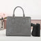 CCW purse in the color gray for women includes unverisal holster.