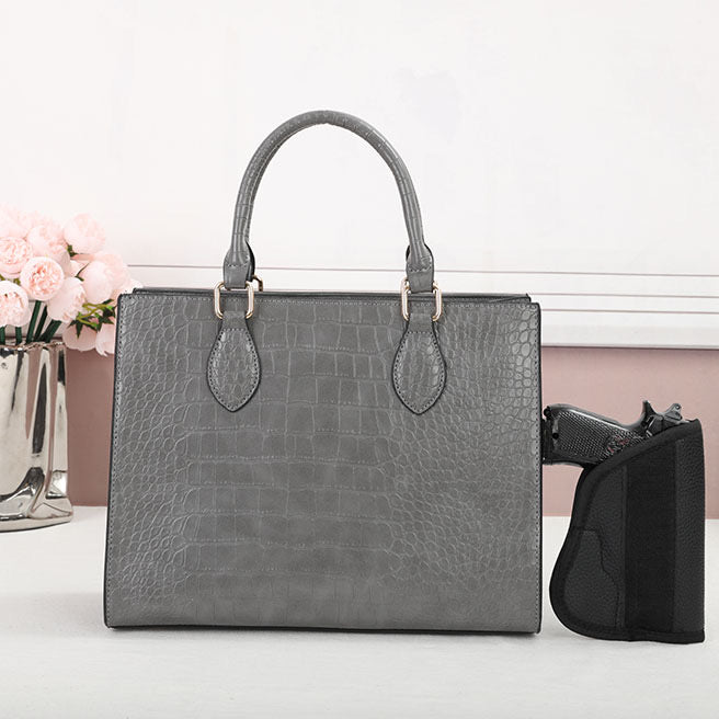CCW purse in the color gray for women includes unverisal holster.