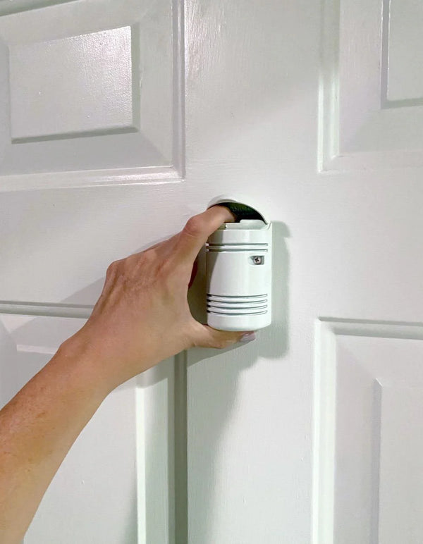 The Guardian Angel Home Defender is a door-mounted pepper spray system.