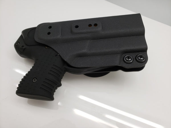 Black JPX pepper gun holster on a white surface