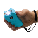 Turquoise stun gun held in a hand with a white background