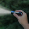 Micro flashlight shown in use.