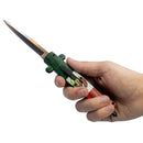 Hand holding a knife with a Mexico green handle on a white background