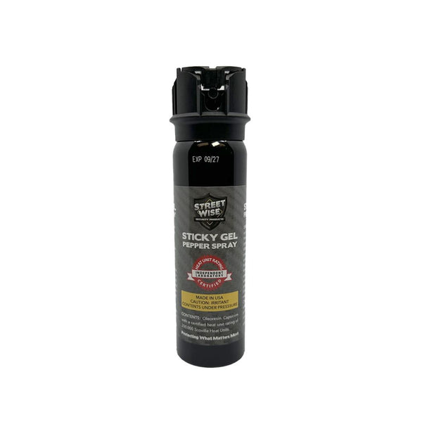 Black pepper spray canister with visible branding on a white background