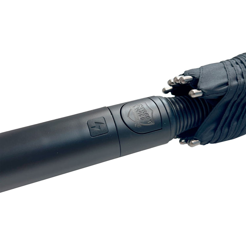 The Streetwise Tactical Stunbrella handle with activation button to turn on electrrode stun function.