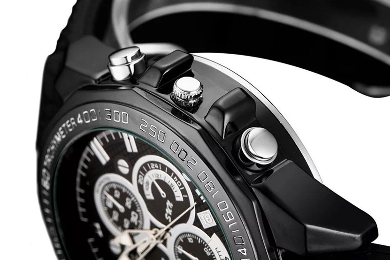 Black wristwatch with built-in disguised spy hidden camera operating buttons.