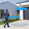 Person walking towards a house talking to a two-way security system.