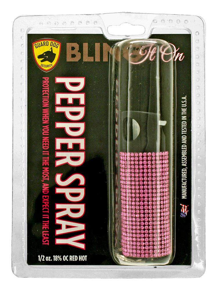 Packaging for mini pepper spray keychains.