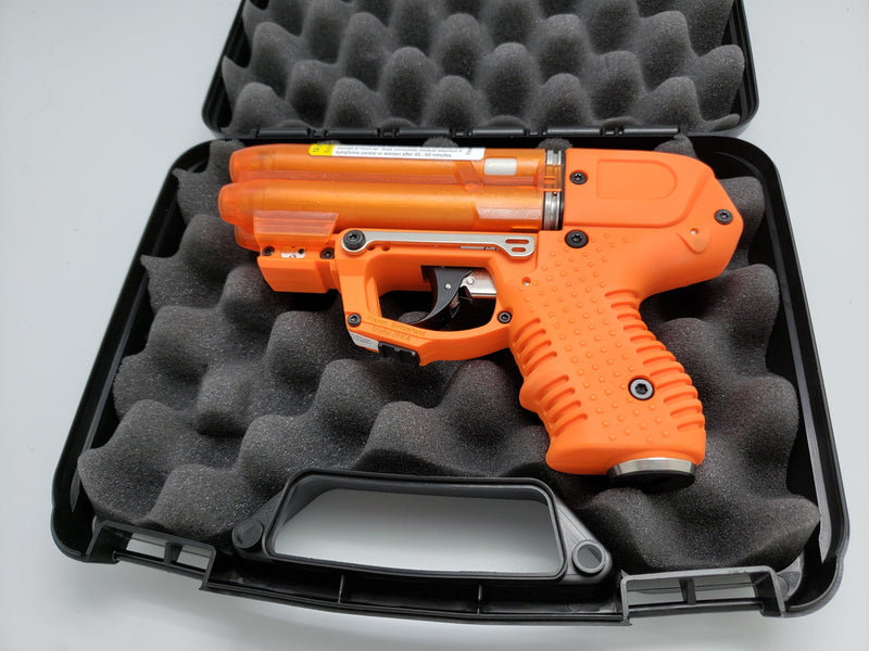 The FIRESTORM orange JPX 6 compact 4 shot pepper gun with laser light bundle package.