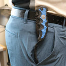 Image shows navy blue knife with belt clip how it appears when worn.
