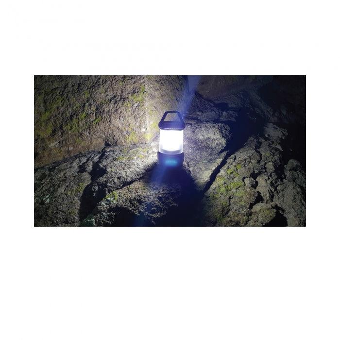 Rechargeable LED Camping Lamp with Power Bank Provides 360 degrees of bright light. Shown in use.