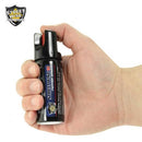 Image shows how to depress the safety lever to use pepper spray.