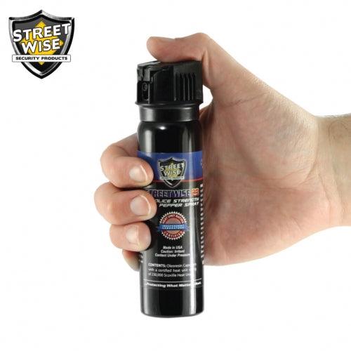 Image shows how to spray pepper spray with flip top.
