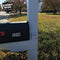 Driveway patrol motion detection alarm system for homes and even business safety. Shown mounted on a mail post.