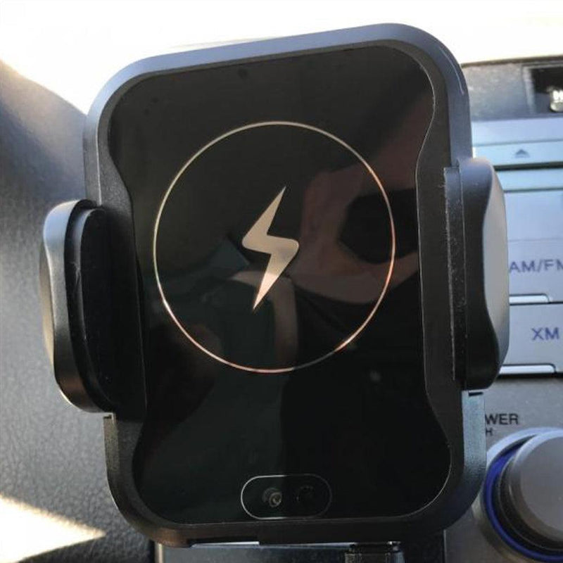 Wireless car charger and holder. Cell phone cradle shown.
