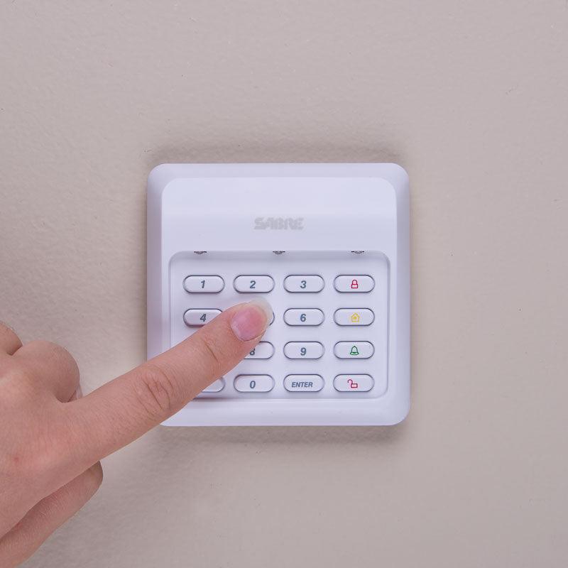Wireless security keypad for home and business protection includes loud panic alarm. Keypad shown.